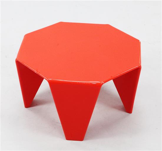 A late 20th century red plastic low table